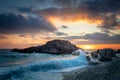 Seascape. Sea Ocean Morning. Wave hit the rock at beach, sea water splash up to the sky with sun. Sunset Sundown at Sea. Storm. Royalty Free Stock Photo