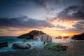 Seascape. Sea Ocean Sunrise time at the sea. Wave hit the rock at beach, sea water splash up to the sky with sun. Sunset Sundown Royalty Free Stock Photo