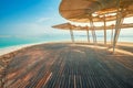 Beach with a wooden walkway and sunshades Royalty Free Stock Photo