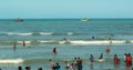 A seascape of the shrine velankanni beach with tour people.