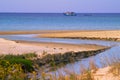 Seascape of small stream and a fishing boat in Maayan Zvi, Hof Hacarmel region Israel.