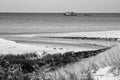 Seascape of small stream and a fishing boat in Maayan Zvi, Hof Hacarmel region Israel.