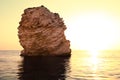 Seascape of still sea waters shore, stony bottom and rocks in sea Royalty Free Stock Photo