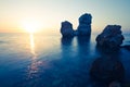 Seascape of still sea waters shore, stony bottom and rocks in sea Royalty Free Stock Photo