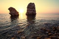 Seascape of still sea waters shore, stony bottom and rocks in sea Royalty Free Stock Photo