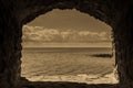 Seascape in stone window casing frame. Royalty Free Stock Photo