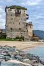 Seascape with Stones Medieval tower in Ouranopoli, Athos, Chalkidiki, Greece Royalty Free Stock Photo