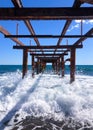 Under the abandoned pier.