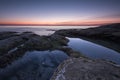 Seascape during sunrise. Beautiful natural seascape, blue hour. Rocky sunrise. Sea sunrise at the Black Sea coast near Ravda.