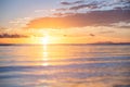 Seascape during the sunrise. Sky and reflections on the water in the summer. Sun rays during the sunrise. Nusa Penida, Bali, Indon