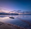 A seascape during sunset in Lofoten islands, Norway. Sand on the seashore. Bright sky during sunset. A sandy beach at low tide. Lo Royalty Free Stock Photo