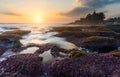 Seascape in sunset with strong wave at Tanah Lot Temple in Bali, Indonesia. Famous landmark tourist attraction and travel destinat Royalty Free Stock Photo