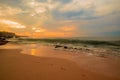 Seascape. Sunset time at the beach. Beach background with footprints in the sand. Tegal Wangi beach, Bali, Indonesia Royalty Free Stock Photo