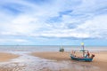 Seascape in Thailand with fishing boats on low tide beach. Royalty Free Stock Photo