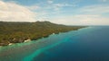 Seascape with tropical island, beach, resort, hotels. Bohol, Anda area, Philippines. Royalty Free Stock Photo