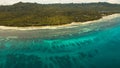 Seascape with tropical island, beach, resort, hotels. Bohol, Anda area, Philippines. Royalty Free Stock Photo