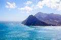 Seascape turquoise ocean water, blue sky, white clouds panorama, mountains view landscape, Cape Town, South Africa coast travel