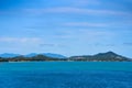 A seascape with turquoise water and islands in the distance. Winter vacation in Thailand Royalty Free Stock Photo