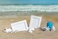 Seascape with two photo frames on the beach sand Royalty Free Stock Photo