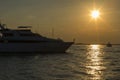 Seascape view of a large motor yacht at sunset in Dubai