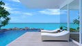 Seascape view from a luxury modern house. Taken view of wooden terrace with swimming pool and pool side bed with bright blue sky