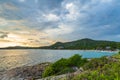 Seascape view with rocky coast and sea with mountain sky and couds before rain. Royalty Free Stock Photo