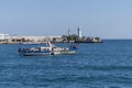 Seascape with a view of the water transport at the pier of the city