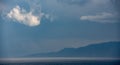 Seascape , white cloud above the mountain on a stormy day.