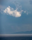 Seascape , white cloud above the mountain on a stormy day.