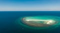 Seascape, white sand island..Atoll near the island of Camiguin, Philippines, aerial view