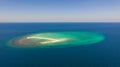 Seascape, white sand island..Atoll near the island of Camiguin, Philippines, aerial view.