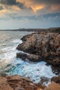 Seascape with windy waves during stormy weather at sunset. Royalty Free Stock Photo