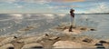 Seascape women relax in summer hat white dress sunset pink sky relaxing stay on rock stone at pier beach sea water seagull