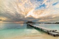 Seascape with wooden jetty at dusk