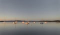 Seascape with yachts moored in the bay with reflections on the water