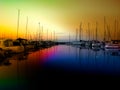 A seascape of yachts moored in a harbour at night