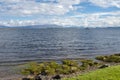 Seascapes with a blue and cloudy sky in summer, Skye Island Highlands, Scotland Royalty Free Stock Photo