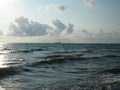 Seascapes. Various kinds of colorful blue sky, sun, clouds and open spaces of the world ocean.Silhouette of lonely boat in the Royalty Free Stock Photo