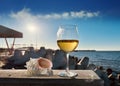 seashell glass with lemonade splash on the beach in sea port blue sky sun beam reflection and scene