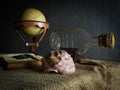 Seashell in interior scene with globe and ship in the bottle