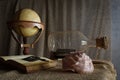 Seashell in interior scene with globe and ship in the bottle concept