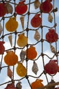 Seashell net sky background. Shell net hanging outdoors. Decorative net. Shell mobile crafts Royalty Free Stock Photo