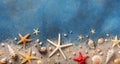 Seashell, starfish and beach sand on blue background. Summer holiday concept. Top view and flat lay Royalty Free Stock Photo