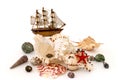 Seashell and toy ship isolated white Royalty Free Stock Photo