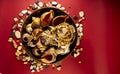 Seashells from the beach and a Buddhist mala bracelet with natural and light blue agate glass stones in a vase. the view from the