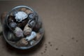 Seashells, chestnuts, cones and wine corks in wine glass. Royalty Free Stock Photo