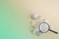 Seashells and magnifying glass. Concept of sea travel, research. Toned photo, selective focus, fog view Royalty Free Stock Photo