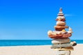 Seashells and rock Zen on the background of sea and blue sky Royalty Free Stock Photo