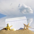 Seashells and starfish with open envelope with blank letter Royalty Free Stock Photo