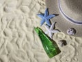 Seashells, a straw hat on the sand with space for text. Beautiful summer beach vacation. Royalty Free Stock Photo